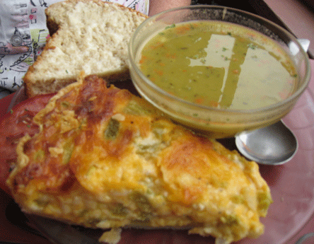Green chile and Cheddar Quiche with a slice of honey rolled oats bread and a cup of split pea soup